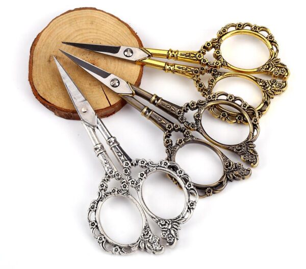 Vintage Floral Needlework Scissors with flower-pattern handles in bronze, silver, gold, and red.